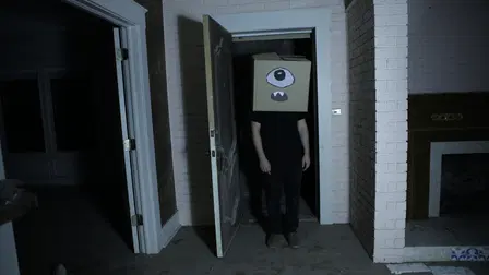 A Ghost and the Boy with a Box on His Head